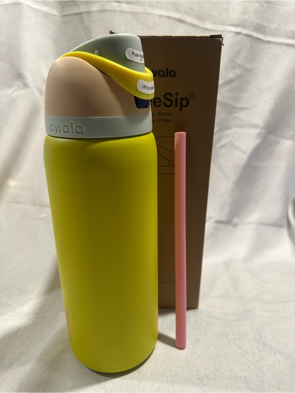Owala insulated water bottle with a built-in straw. Lemon Limeade colorway 32oz
